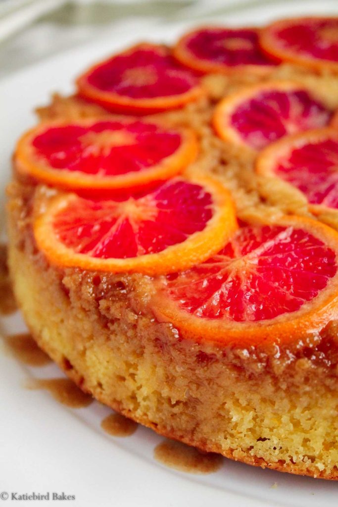 close up view of the finished Blood Orange Upside-Down Cake on a white plate