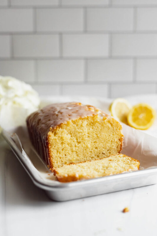 Baked lemon yogurt cake with a slice cut