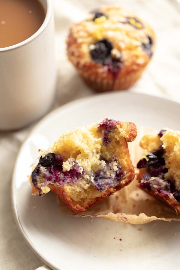 cross section view of a muffin test using baking powder and baking soda, showing a taller muffin with fluffier crumb